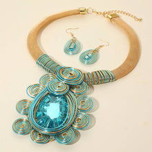 Load image into Gallery viewer, Sensibling Corp. - Bold Teardrop Stone Centered Metal Swirl Embellished Statement Necklace: Clear