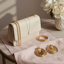 Load image into Gallery viewer, PinktownUSA - Clip On Organic Gold Oval Cream Pearl Earrings: Color: Cream / Plating: Gold / Size: 2.2 x 1.75 inches
