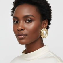 Load image into Gallery viewer, PinktownUSA - Clip On Organic Gold Oval Cream Pearl Earrings: Color: Cream / Plating: Gold / Size: 2.2 x 1.75 inches

