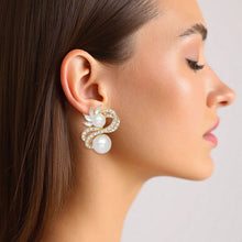 Load image into Gallery viewer, PinktownUSA - Clip On High End Gold Ribbon Cream Pearl Earrings: Color: Cream / Plating: Gold / Size: 1.5 x 1.25 inches
